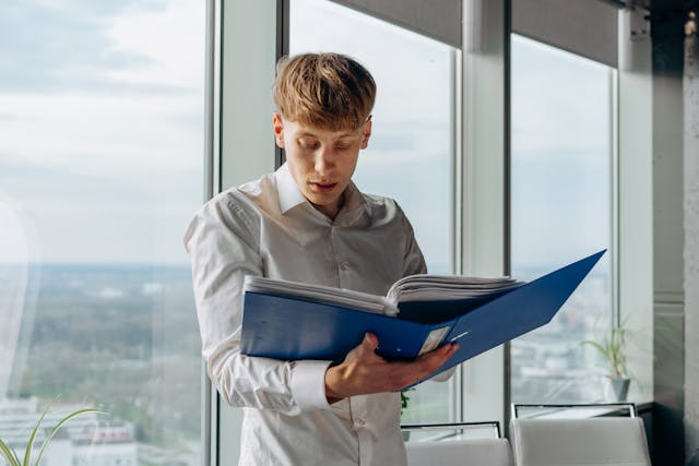 Person%20looking%20through%20a%20binder